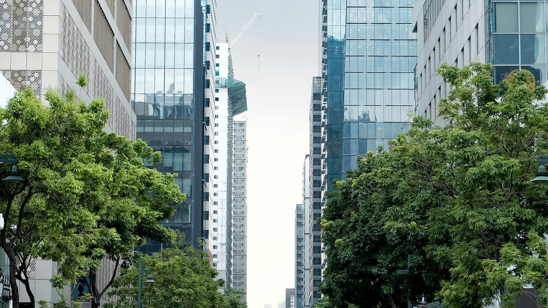 a couple of tall buildings sitting next to each other